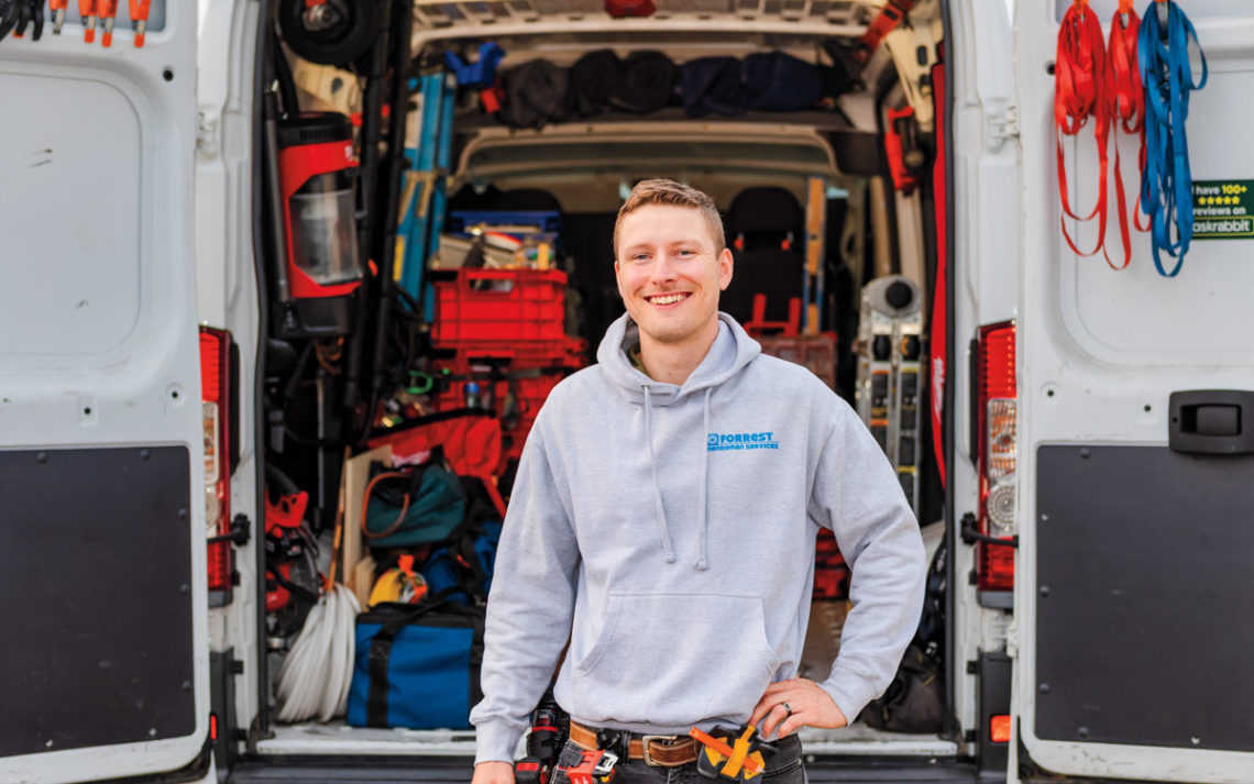 Forrest Childers stands in front of his open van doors revealing his tools.